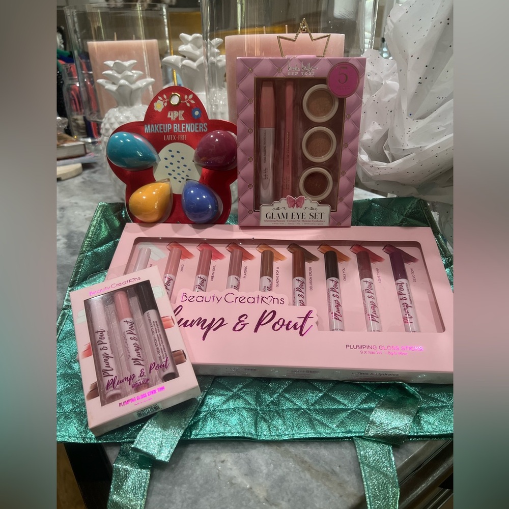 NIB Cosmetics, Plumbing Lip Glosses, Eye Shadows, sponges and Cosmetic bag.